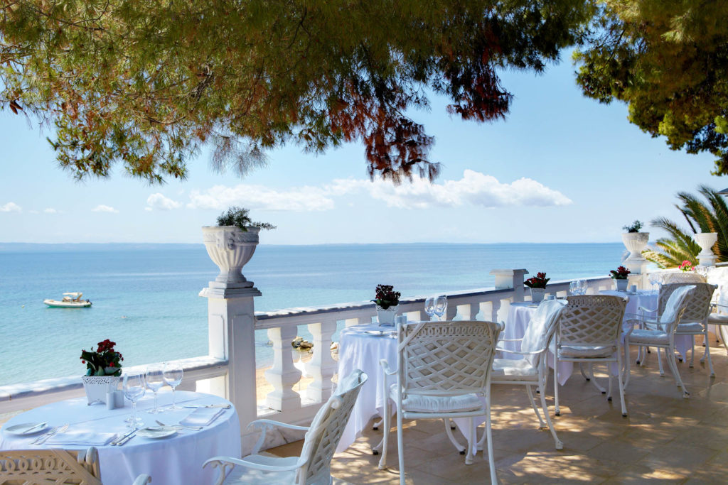 Outdoor terrace restaurant with a view of the ocean